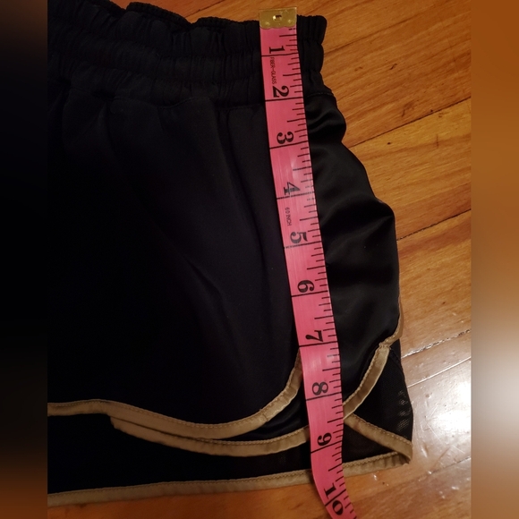Lululemon Super Squad shorts. Black and gold. Size 6. Built in liner. - Picture 9 of 12